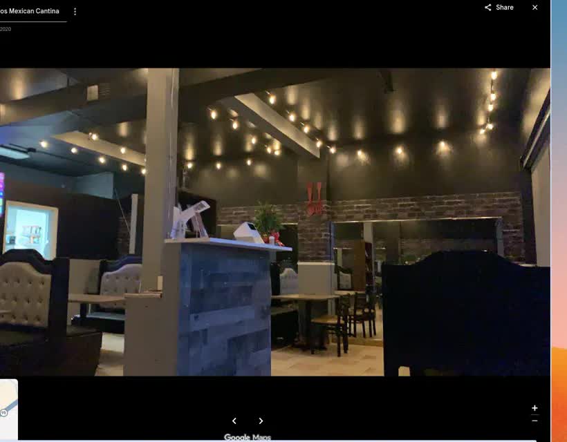 The dining room, string lights and booths