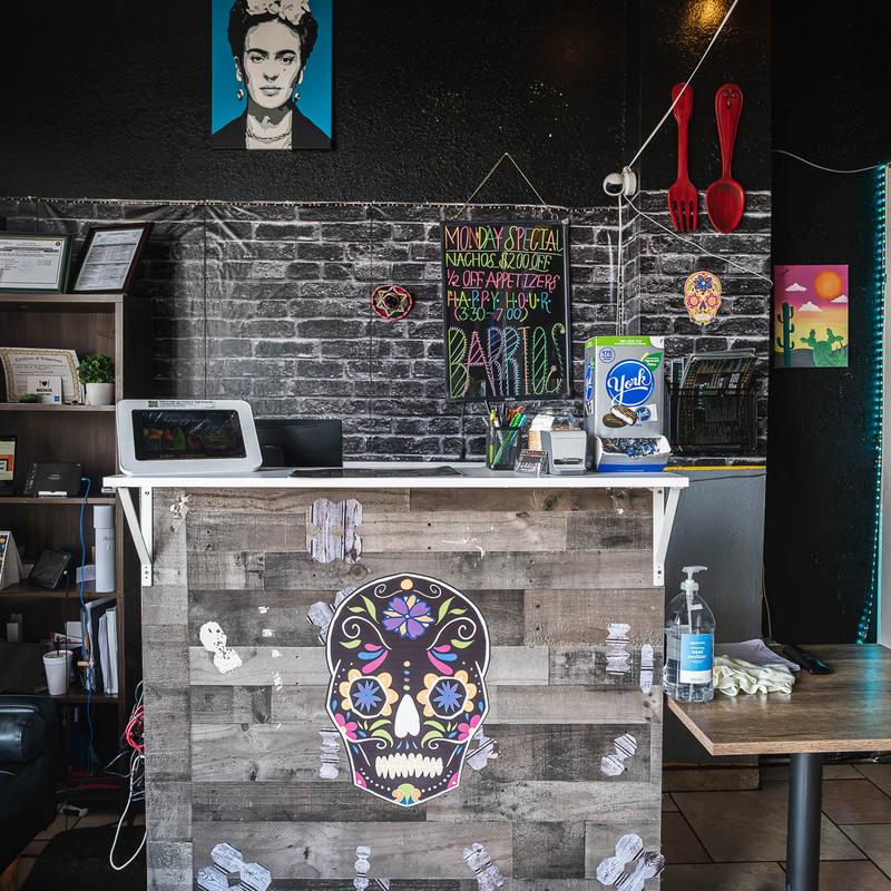 Host stand, chalkboard, sugar skull